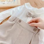 Boys White Full Sleeves Shirt, bow tie and Grey Shorts set - Image 2