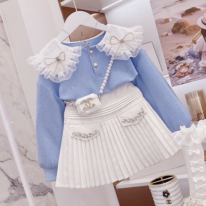 SWEA-19041 (1) Stylish and Elegant Blue Blouse with Shoulder Bow & White Skirt Set for Girls - Image 1
